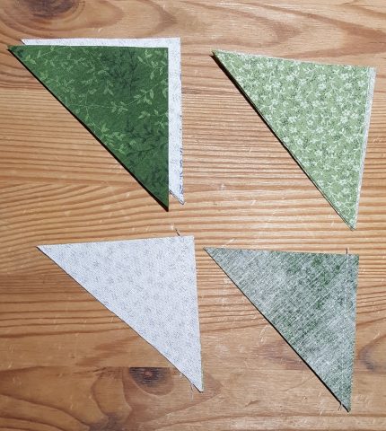 Sewing the triangle pieces together for Ohio Star quilt block