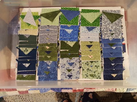 Cut pieces for the Ohio Star blocks of an Eventide quilt top